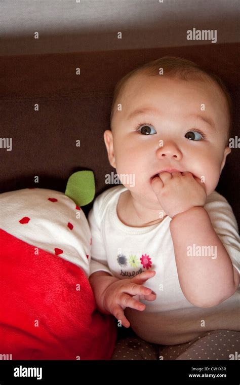 Thinking baby girl Stock Photo - Alamy