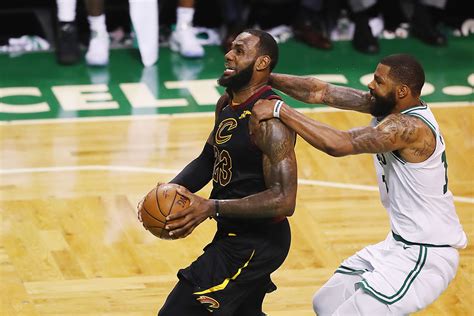 LeBron James carries Marcus Morris of the Boston Celtics on his back ...