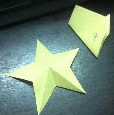 用长条纸一步一步教我折小星星 求详细折法