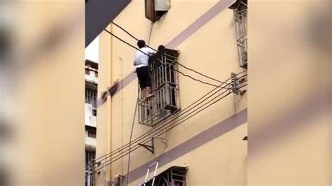 4岁女童身悬6楼阳台 过路男子徒手爬楼救下女孩_荔枝网