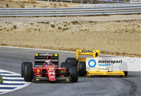 Gerhard Berger, Ferrari 640, leads Nelson Piquet, Lotus 101 Judd ...