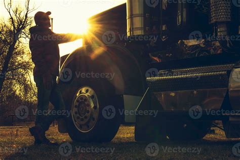 Semi Truck Driver in Front of His Vehicle During Scenic Sunset 24629196 ...