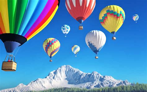 五彩缤纷的热气球图片-晴天阳光下飞跃农田的五彩缤纷的热气球素材-高清图片-摄影照片-寻图免费打包下载